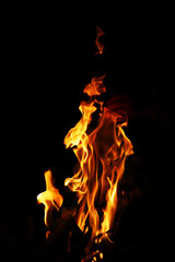 Fire flames on black background. Closeup of fire flames isolated on black background