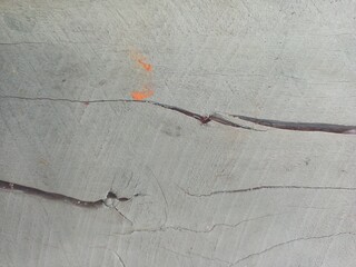 Abstract Cracked Concrete Surface with Orange Accents