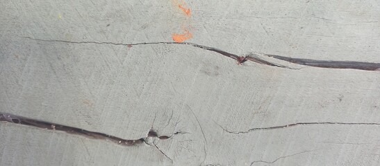 Abstract Cracked Concrete Surface with Orange Accents