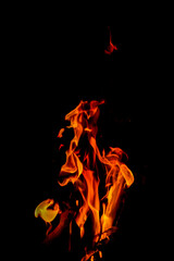 Fire flames on black background. Closeup of fire flames isolated on black background