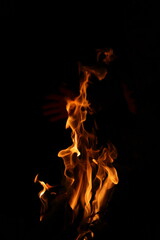 Fire flames on black background. Closeup of fire flames isolated on black background