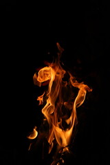Fire flames on black background. Closeup of fire flames isolated on black background