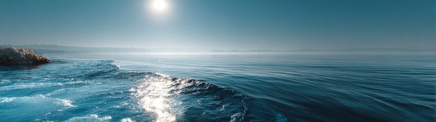 Fototapeta premium Serene Minimalist Ocean Vista, an expansive view of tranquil waters meeting a softly blurred horizon, embodies simplicity and calmness in a clean, uncluttered setting.