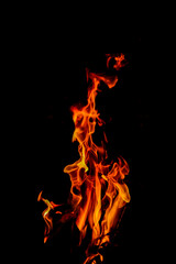 Fire flames on black background. Closeup of fire flames isolated on black background