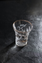 Small glass filled with anise-flavored drink, capturing the essence of traditional taste, herbal aroma, and cultural rituals in a minimal and elegant presentation.