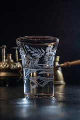 Small glass filled with anise-flavored drink, capturing the essence of traditional taste, herbal aroma, and cultural rituals in a minimal and elegant presentation.