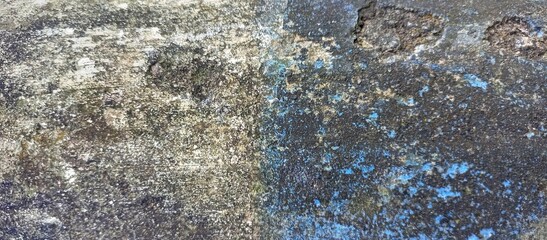 Grunge Distressed Concrete Surface with Blue Paint Stain