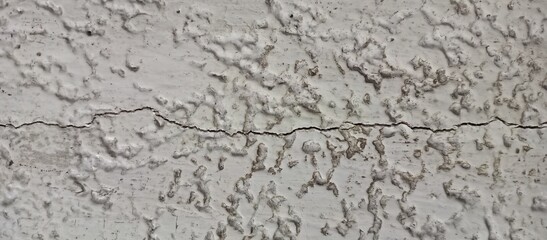 Heavily Textured Stucco Wall with Horizontal Crack
