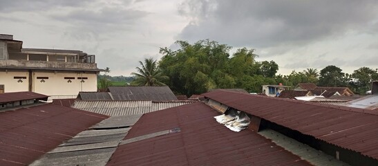 Overcast Sky Over Worn Factory Roofs