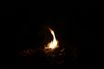 Fire flames on black background. Closeup of fire flames isolated on black background