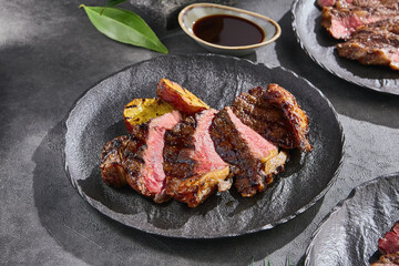New York steak with grilled potato, bright lighting, overhead composition