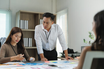 Ux designers working on user interface of mobile application in office meeting