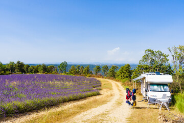 Clothes hanging to dry outdoors by camping car. Caravan vacation in France