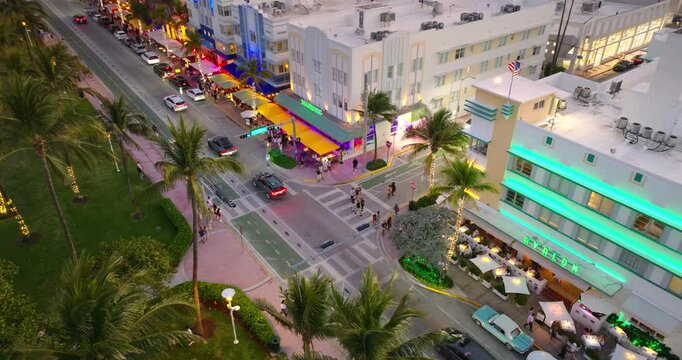 Iconic palm lined Ocean Drive at night in Miami Beach. A must visit Florida destination.