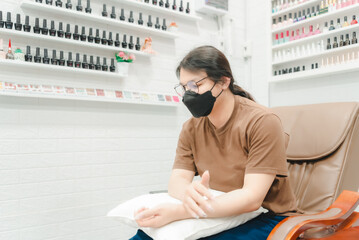Woman (LGBTQ) do a manicure or pedicure at nails