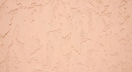 Textured pink stucco wall surface background in soft daylight