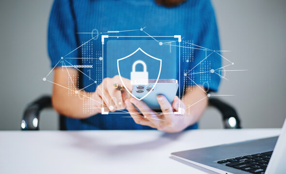 Woman holding smartphone with holographic lock and data network graphics. Concept of cybersecurity, privacy, mobile protection
