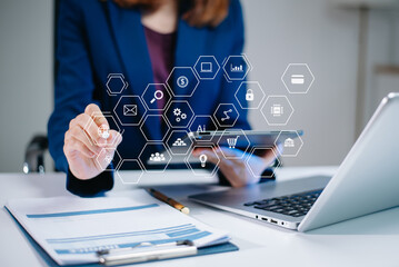 Business hand analyzing sales data and economic growth and pointing at business report document with icon