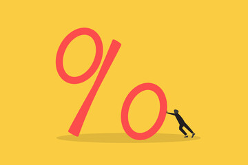 Businessman pushing part of large percentage sign