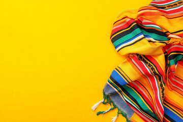 Colorful striped textile on yellow background vibrant fabric texture design element