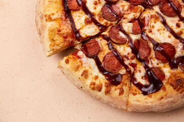 An appetizing sausage pizza, freshly made from the oven