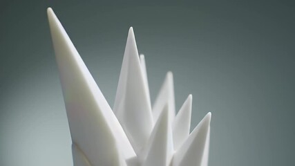 Abstract white spikes with iridescent color cast on gray background - Powered by Adobe