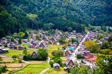 Viewpoint of Japanese traditional Gassho house in  the Historical Japanese Village of Shirakawa-go with the early autumn foliage season background, Gifu,  Japan