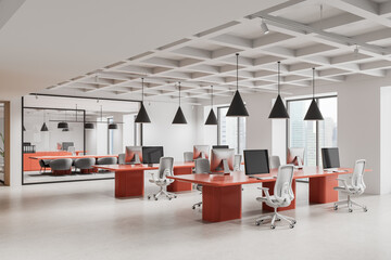 Modern open space office with red desks, white chairs, and large windows in a city high-rise...