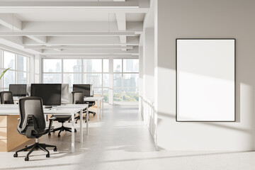 Modern open space office interior with blank poster and panoramic city view through large windows in bright minimalistic design. 3D Rendering