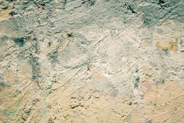 Randomly painted concrete wall as a backdrop for design work and more.