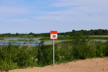 Warning Sign Near Wetlands Please help us preserve the vital natural habitats and ecosystems