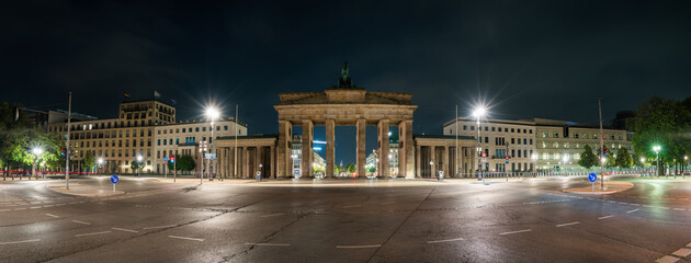 The Brandenburg Gate panorama at night in Berlin. Germany