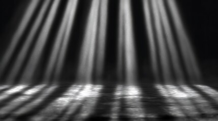 Dramatic light rays illuminate dark floor background