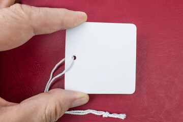 Blank Tag with a string on a red background