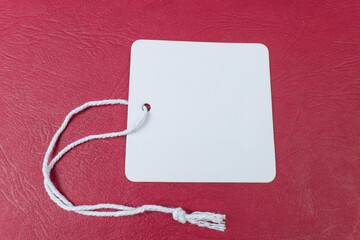 Blank Tag with a string on a red background
