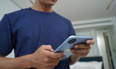 Worker with tablet computer checking alarm system