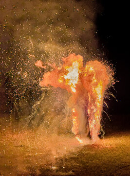 Big burning wheel rolling from the hill as Latvian traditional ritual at midsummer or solar solstice celebration