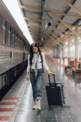 Woman Traveling with Suitcase at Train Station