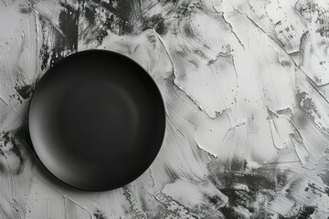 sharp image of above view black plate on white plastering board