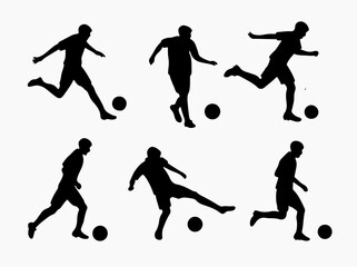 Silhouette of Soccer Players Kicking a Ball in Various Poses