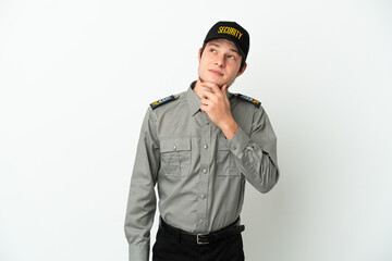 Young Russian security man isolated on white background and looking up