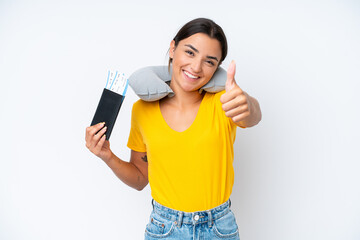 Woman with Inflatable Travel Pillow over isolated background with thumbs up because something good...