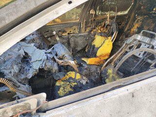 Inside view of a destroyed from fire car. 
