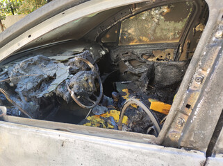 Close up Inside view of a destroyed from fire car. 
