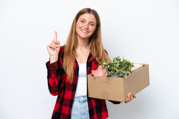 Young caucasian woman making a move while picking up a box full of things isolated on white...