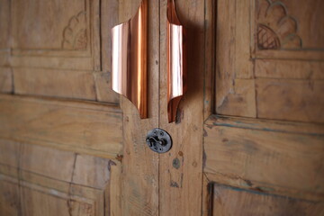 Antique Carved Wooden Doors with Brass Handles and Latch