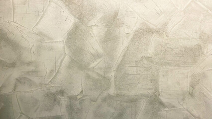 Textured plaster wall surface showing irregular brush and trowel strokes.
Used for decorative interior wall finishing, providing a rustic or artistic appearance.
