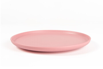 Empty pink circle ceramics plate isolated on white background