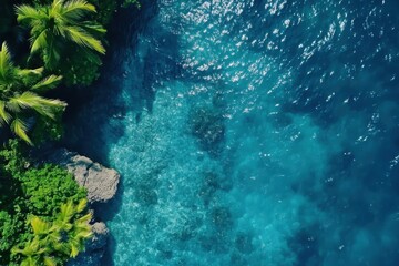 Obraz premium Moving across the tranquil blue sea surface with lush greenery nearby, Moving Over Blue Sea Surface