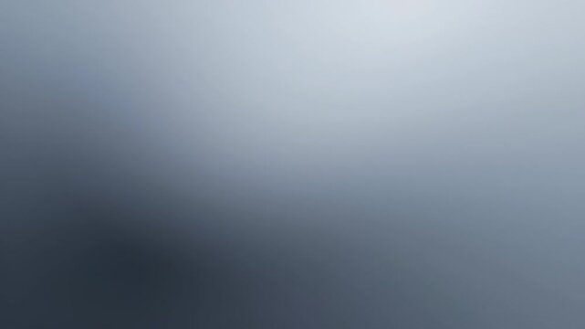 Abstract blue and gray gradient background featuring a soft, smooth color transition, ideal for modern design.